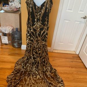 Mother of the bride dress has a beautiful bustle on the back worn once for wed